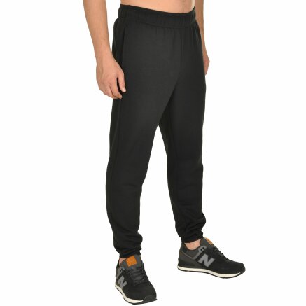 Спортивнi штани New Balance Essential Tapered - 105470, фото 4 - інтернет-магазин MEGASPORT
