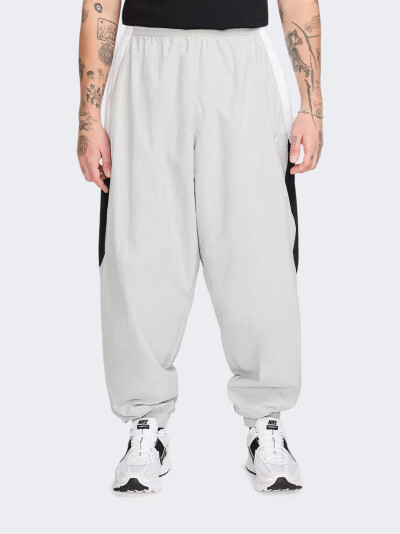 Спортивнi штани Nike M NK CLUB WVN TRK PANT OS - 175211, фото 1 - інтернет-магазин MEGASPORT